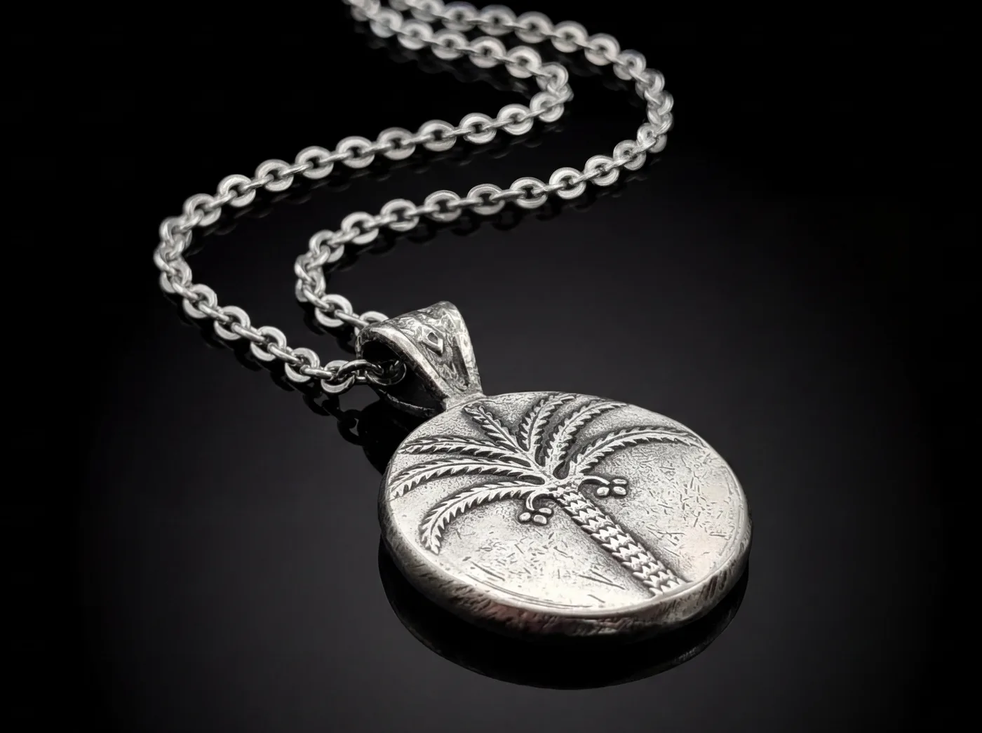 תליון עץ תמר, 100 פרוטה - מהמטבעות הראשונים של ישראל