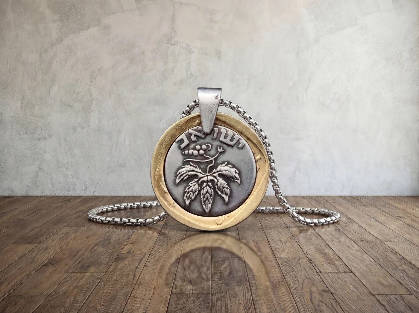 תליון גפן, 50 פרוטה, שנת 1949. מהמטבעות הראשונים של ישראל